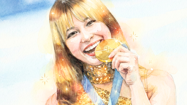 金メダルをかじるアリサ・リウ選手